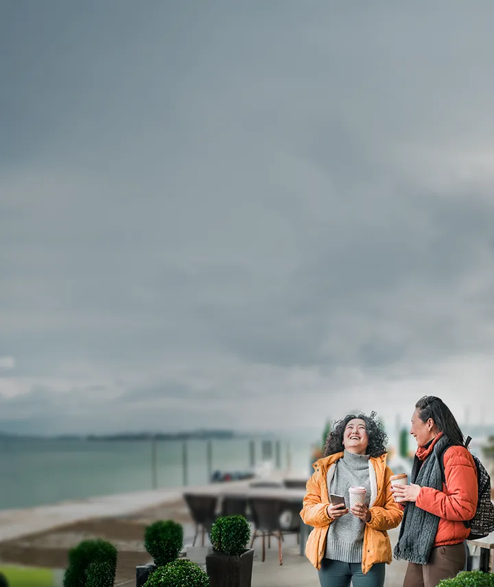 Two friends chatting over coffee
