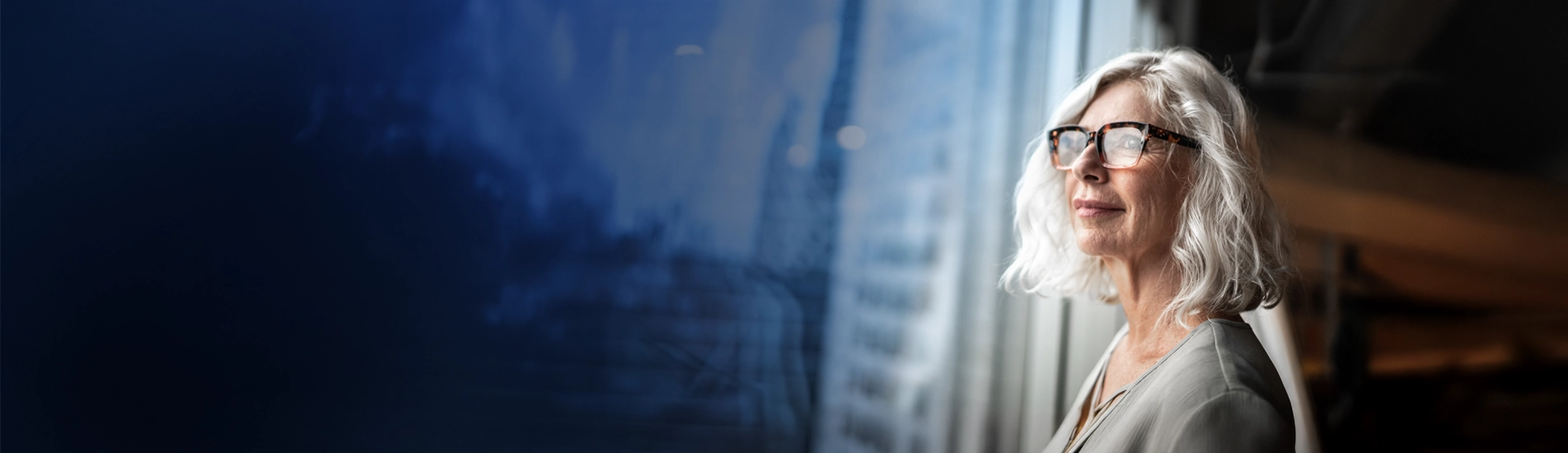 woman looking out window